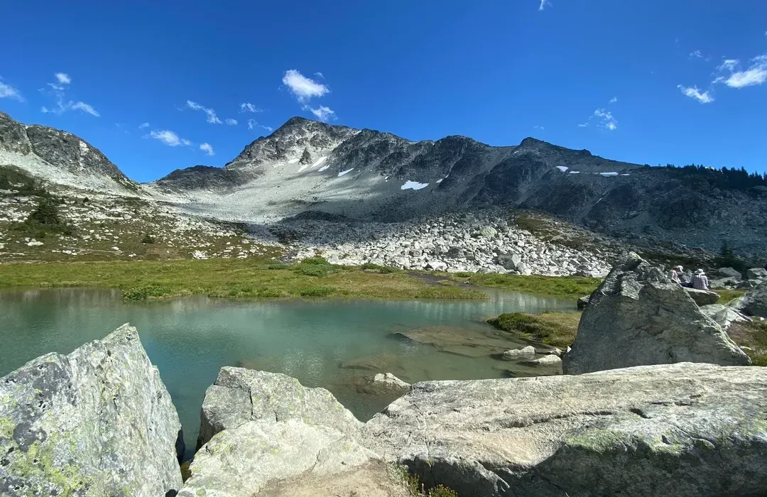 View of a small lake amongst the mountains of Blackcomb Glacier Provincial Park
